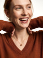 Woman laughing, wearing the Everyday Loop Necklace