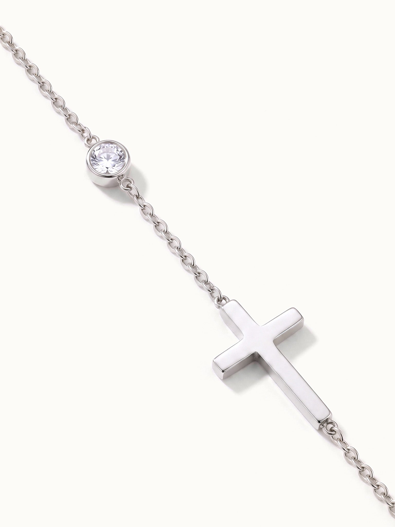 Beside Me Cross Bracelet in silver, close-up of the chain, stone and cross