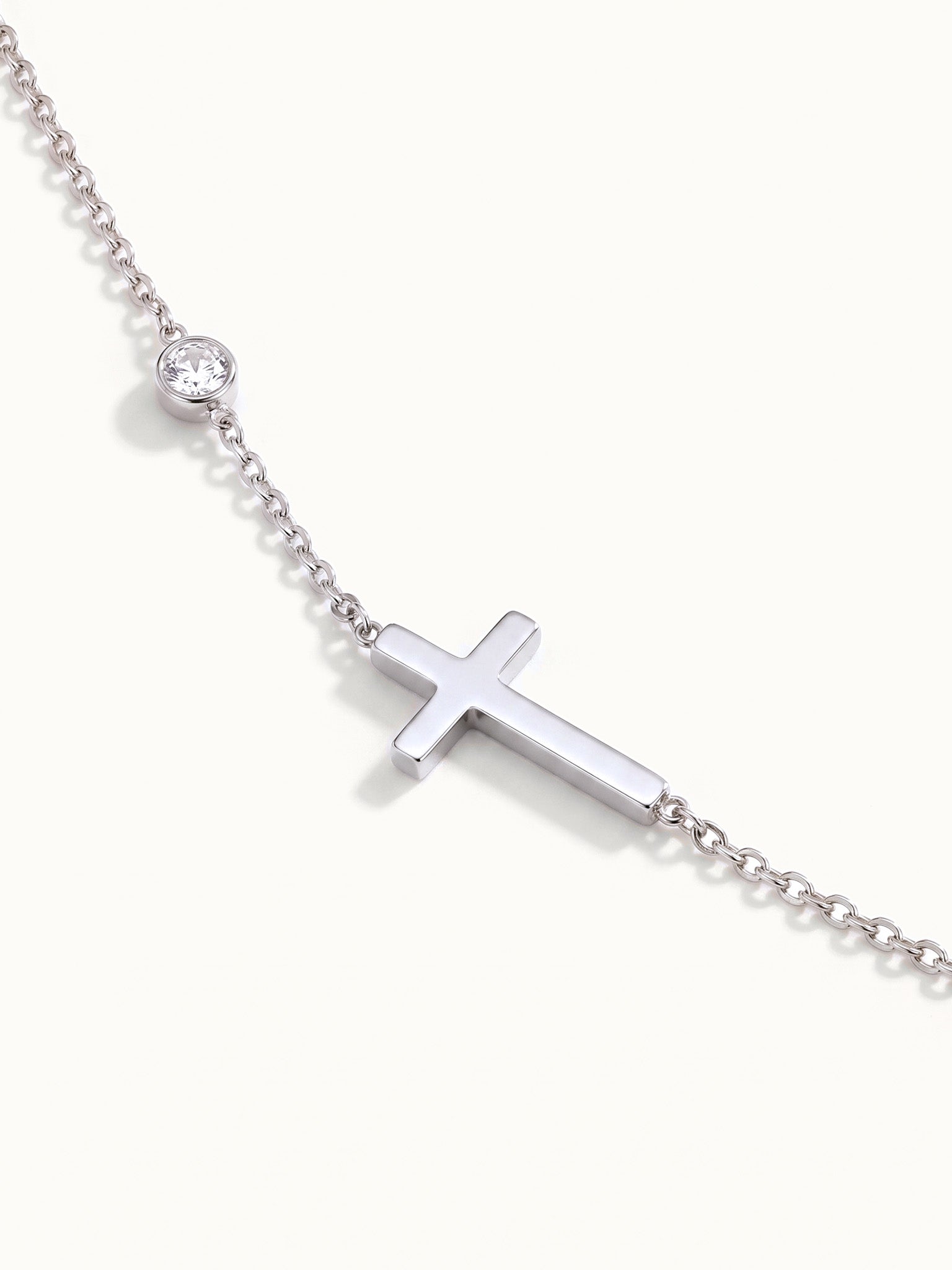 Beside Me Cross Bracelet in silver, close-up of the cross and stone