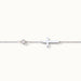 Beside Me Cross Bracelet in silver, laid straight with the cross and stone