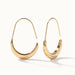 Evening Grace Drop Earrings – pair of tapered drop hoops, standing upright, gold, on ivory background