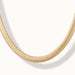Everlasting Chain Necklace – close-up of the flat snake chain at the bottom of the curve, gold, on ivory background