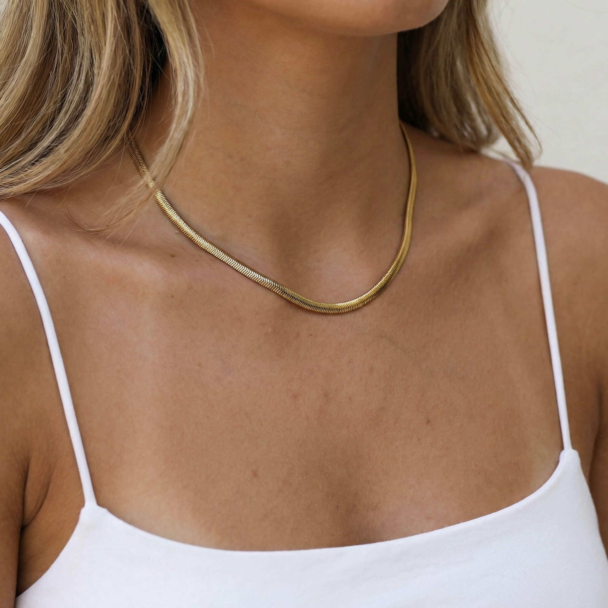 Everlasting Chain Necklace – worn at the collarbone, gold, white strap top
