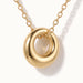 Everyday Loop Necklace – close-up of the loop pendant on its chain, gold, on ivory background