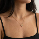 Everyday Loop Necklace – worn at the collarbone, gold, black strappy top