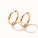 Faithful Hoops – pair of plain polished hoops, angled view, gold, on ivory background
