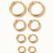 Faithful Hoops – all four sizes lying flat, 12mm to 6mm, gold, on ivory background