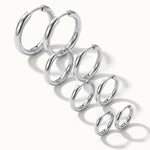 Faithful Hoops – all four sizes in a diagonal line, 12mm to 6mm, silver, on ivory background