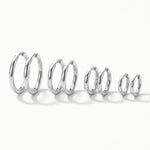 Faithful Hoops – all four sizes standing in a row, 12mm to 6mm, silver, on ivory background