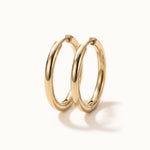 Faithful Hoops – pair of plain polished hoops, 12mm, gold, on ivory background