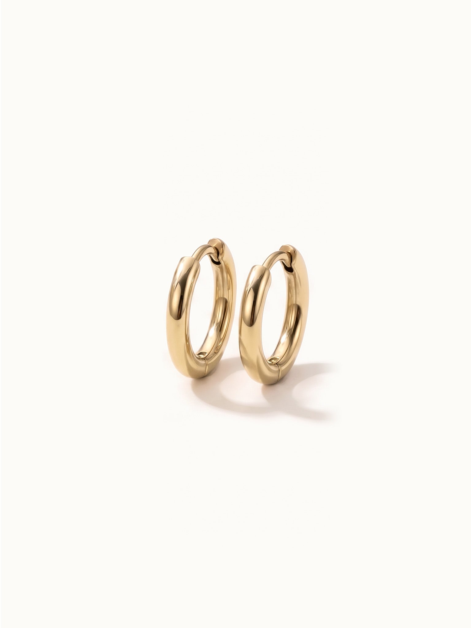 Faithful Hoops – pair of plain polished hoops, 6mm, gold, on ivory background