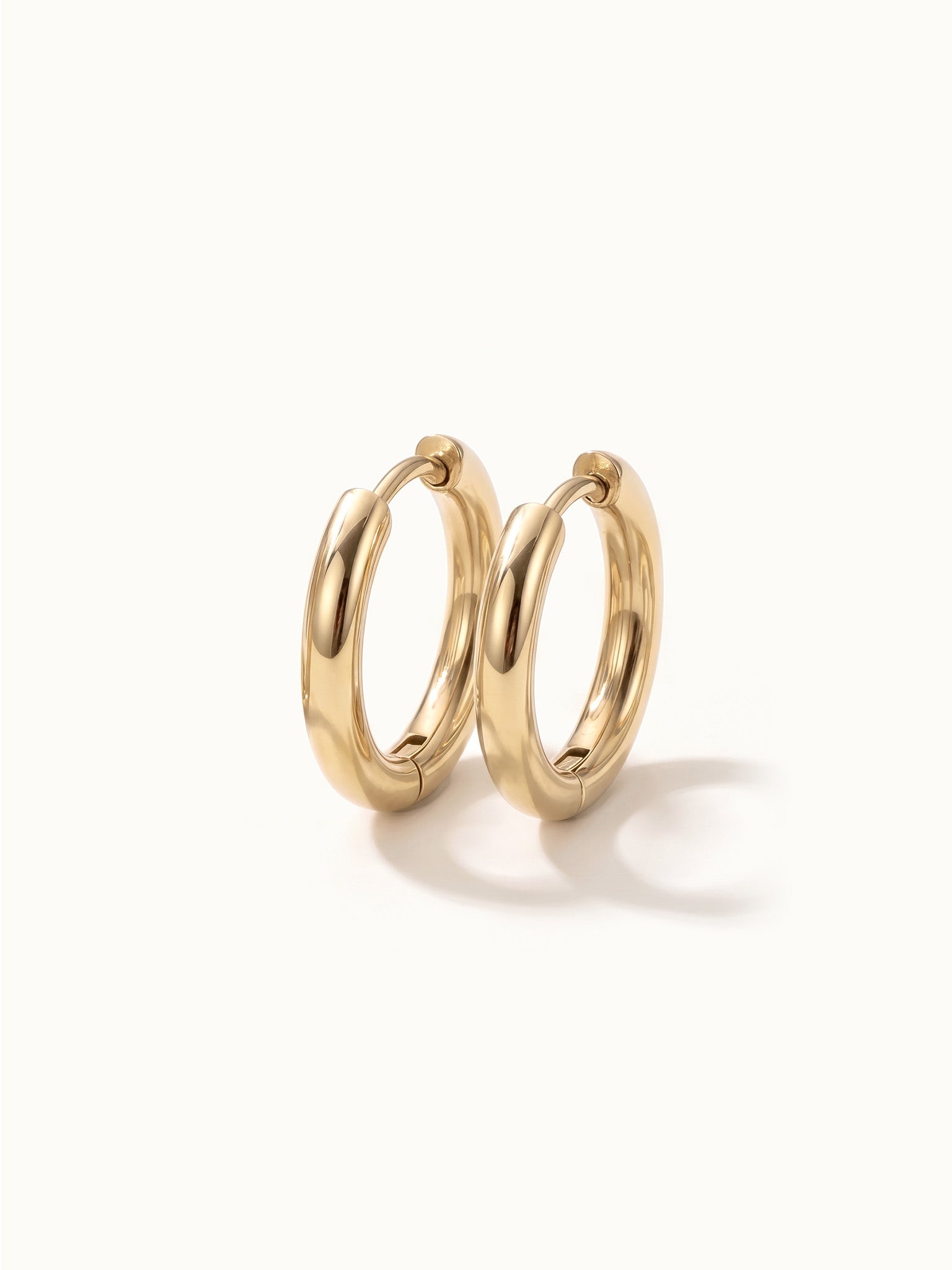 Faithful Hoops – pair of plain polished hoops, 8mm, gold, on ivory background
