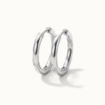 Faithful Hoops – pair of plain polished hoops, 10mm, silver, on ivory background