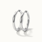 Faithful Hoops – pair of plain polished hoops, 12mm, silver, on ivory background
