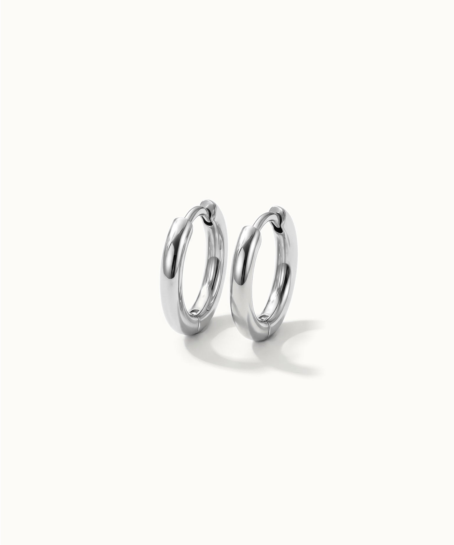 Faithful Hoops – pair of plain polished hoops, 6mm, silver, on ivory background