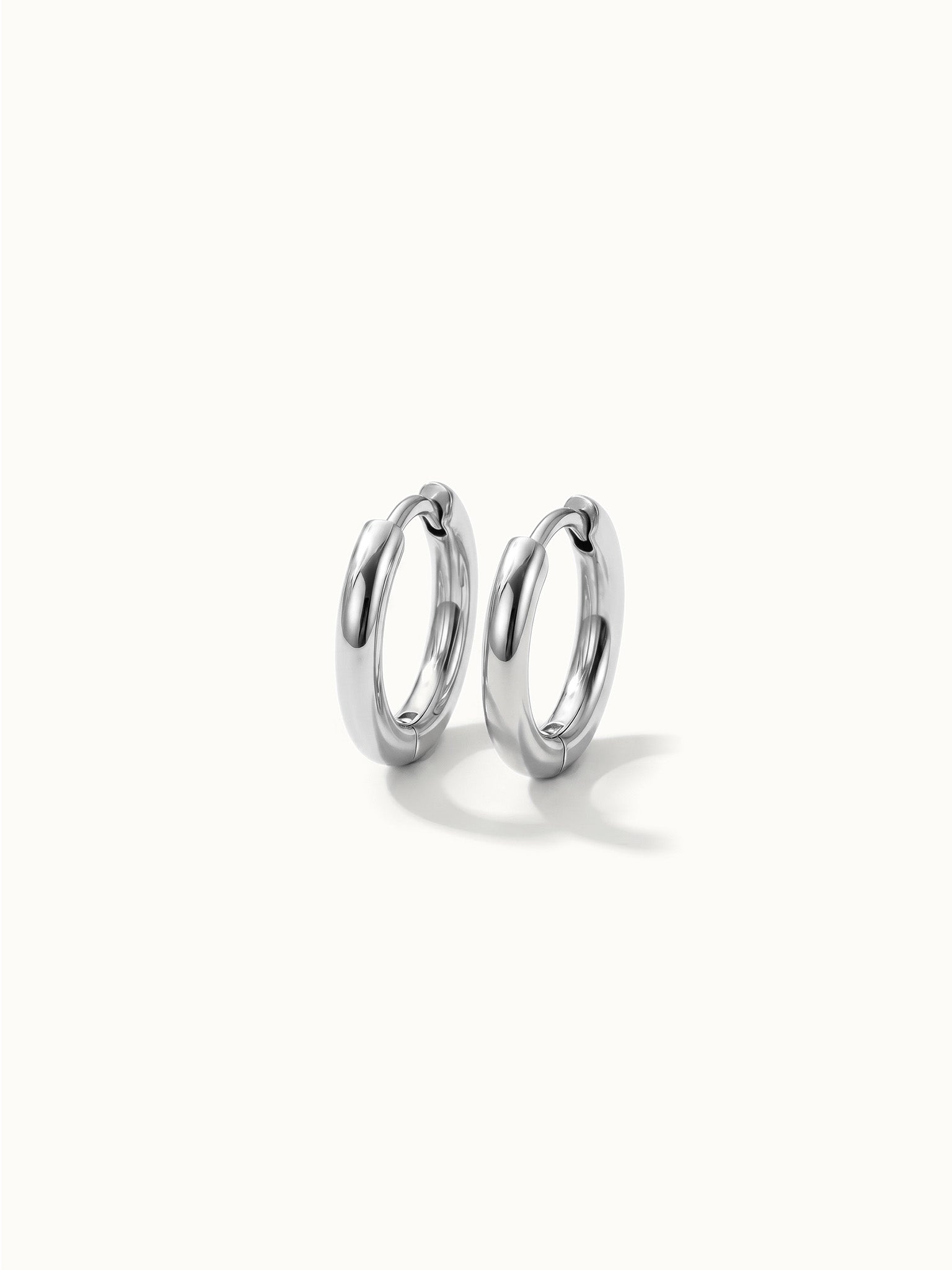 Faithful Hoops – pair of plain polished hoops, 6mm, silver, on ivory background