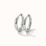 Faithful Hoops – pair of plain polished hoops, 8mm, silver, on ivory background