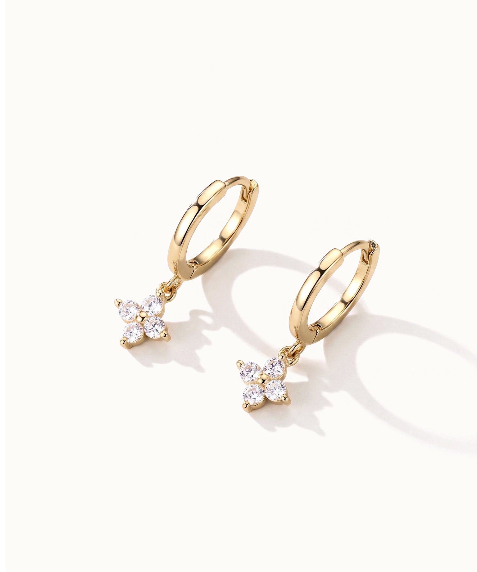 Field Lily Drop Earrings – pair of flower drop huggie hoops, gold, on ivory background