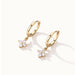 Field Lily Drop Earrings – pair of flower drop huggie hoops, gold, on ivory background