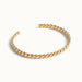Fire & Roots Cuff – rope-twist cuff, angled view, gold, on ivory background