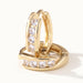 Four Seasons Huggies – close-up of the four-stone huggie hoops, gold, on ivory background