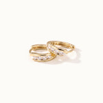 Four Seasons Huggies – pair of four-stone huggie hoops, gold, on ivory background
