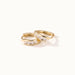 Four Seasons Huggies – pair of four-stone huggie hoops, gold, on ivory background