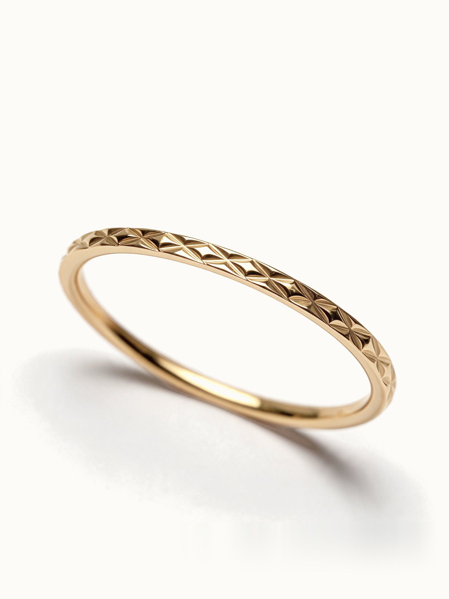 Golden Season Band – close-up of the woven texture, gold, on ivory background