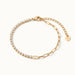 Grace Line Bracelet – crystal row at the front with paperclip links and heart charm, angled view, gold, on ivory background