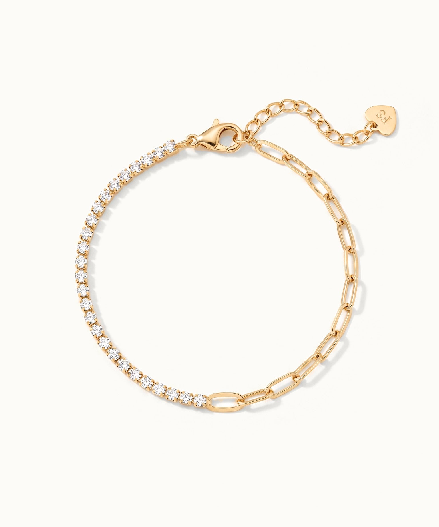 Grace Line Bracelet – laid in a circle with clasp and extender at the top, seen from above, gold, on ivory background