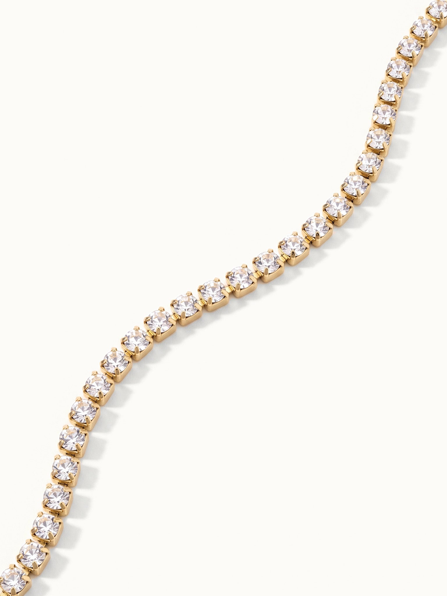 Grace Line Bracelet – close-up of the crystal row, gold, on ivory background