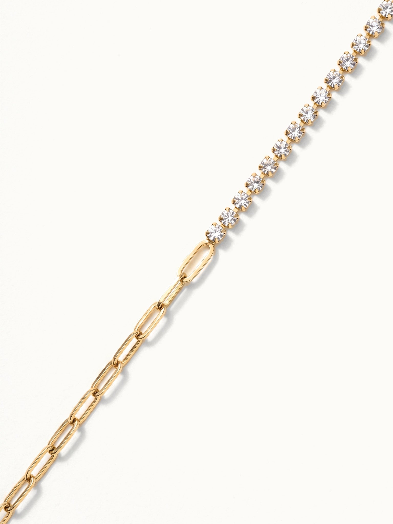 Grace Line Bracelet – close-up of the crystal row meeting the paperclip links, gold, on ivory background