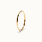 Grace Stack Ring – 45° view, gold, on ivory background