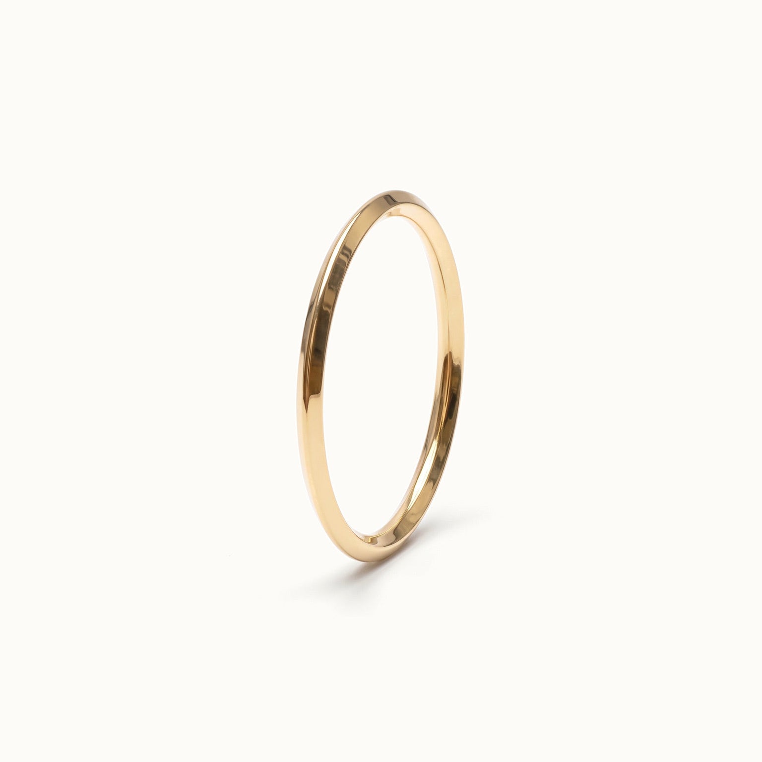 Grace Stack Ring – 45° view, gold, on ivory background