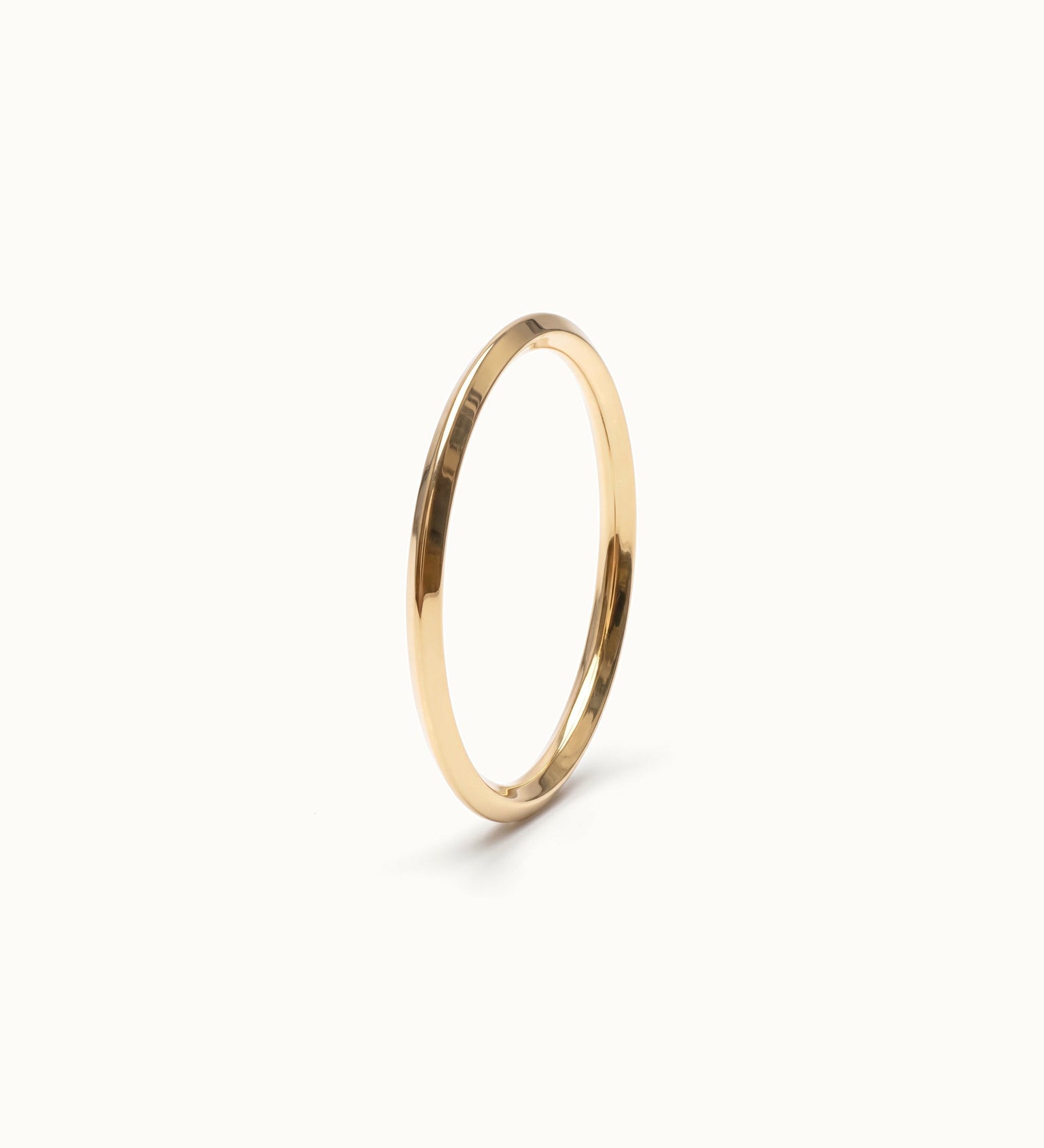 Grace Stack Ring – 45° view, gold, on ivory background