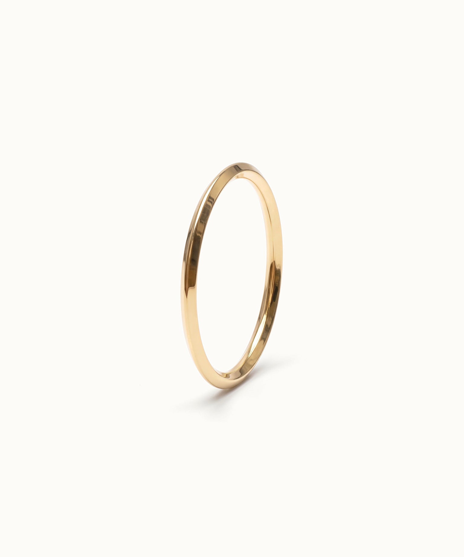Grace Stack Ring – 45° view, gold, on ivory background