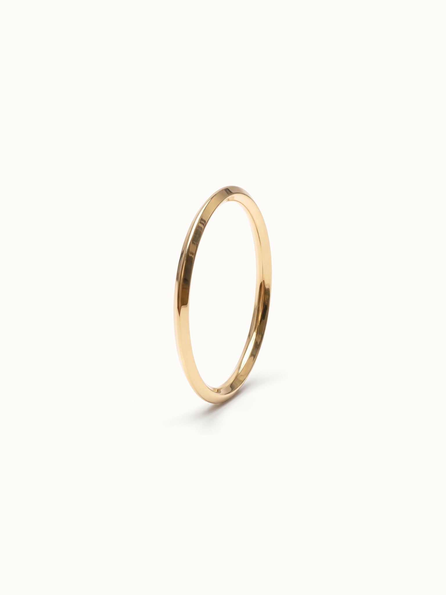 Grace Stack Ring – 45° view, gold, on ivory background