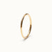 Grace Stack Ring – 45° view, gold, on ivory background