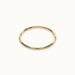 Grace Stack Ring – flat 45° view, gold, on ivory background