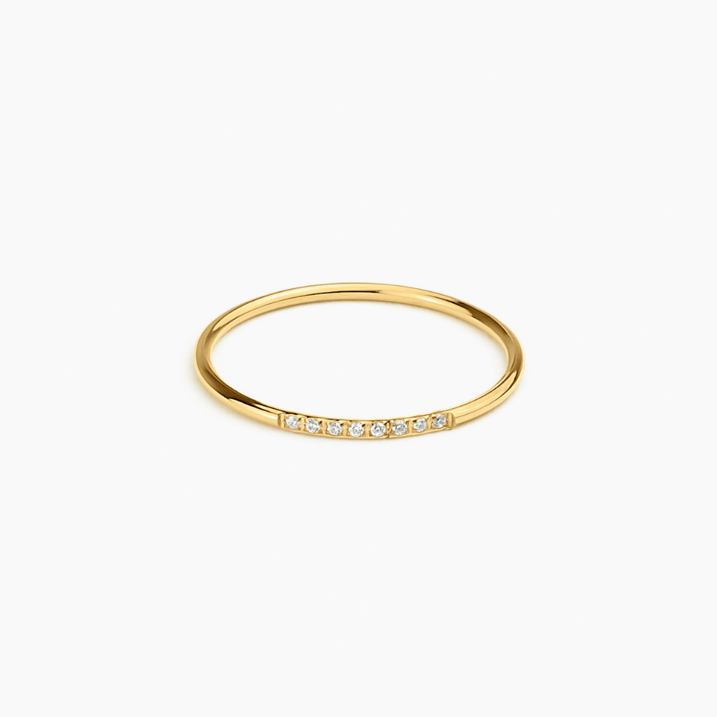 Halo Band in 14k gold with pavé diamonds across the band, flat lay