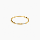 Halo Band in 14k gold with pavé diamonds across the band, flat lay