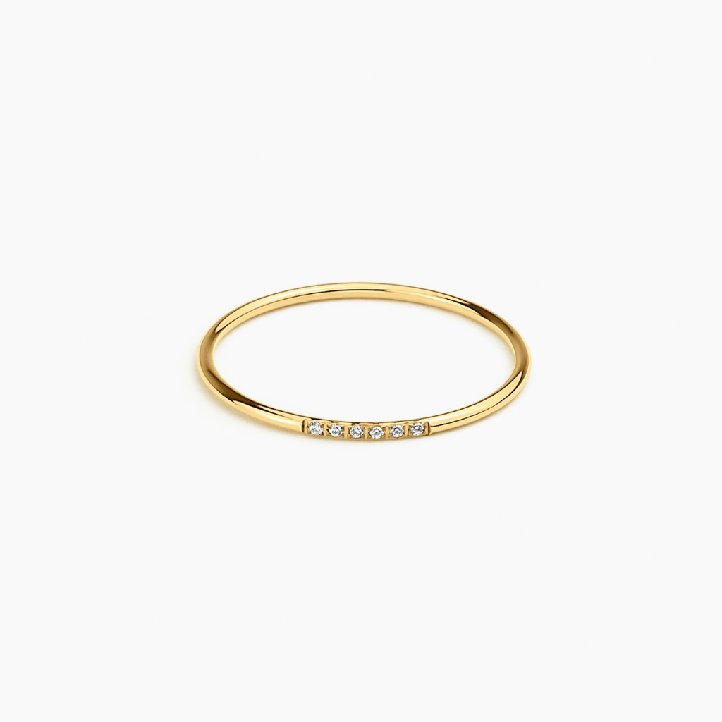 Halo Band in 14k gold with pavé diamonds across the band, flat lay