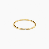 Halo Band in 14k gold with pavé diamonds across the band, flat lay