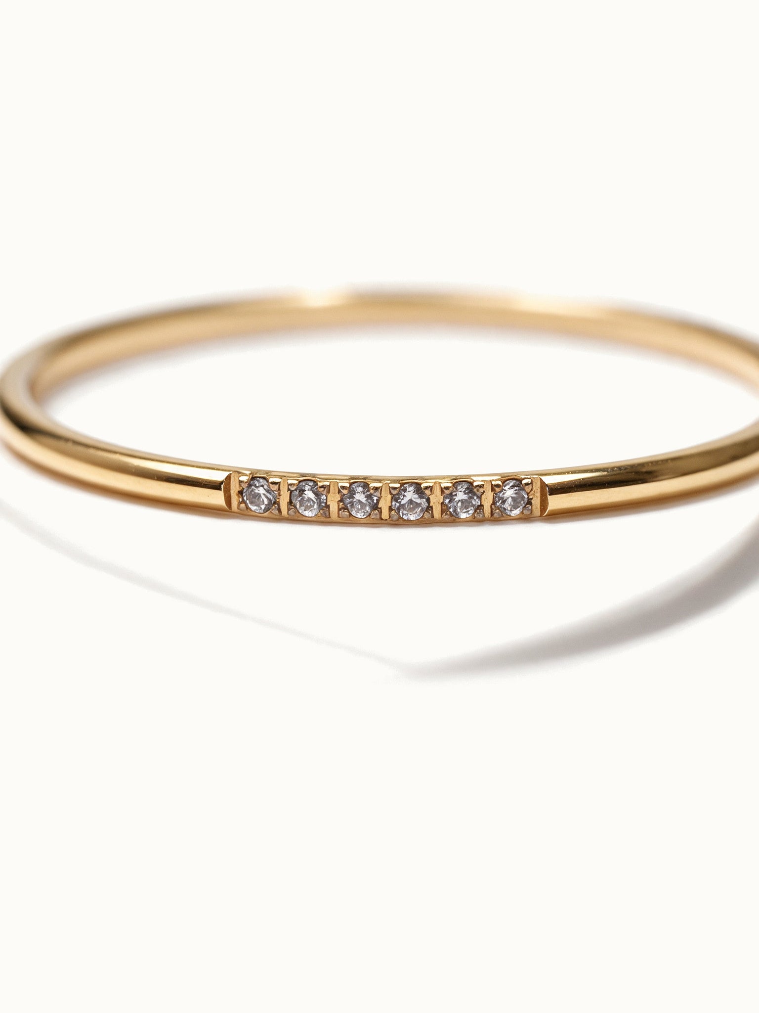 Halo Band Ring 6-stone – close-up detail, gold, on ivory background