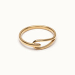 Held Ring – flat 45° view, gold, on ivory background
