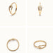Held Ring – four-angle grid, gold, on ivory background
