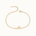 Initial Bracelet – letter A charm on a fine cable chain, gold, on ivory background