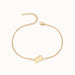 Initial Bracelet – letter B charm on a fine cable chain, gold, on ivory background
