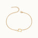 Initial Bracelet – letter D charm on a fine cable chain, gold, on ivory background