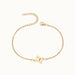 Initial Bracelet – letter H charm on a fine cable chain, gold, on ivory background
